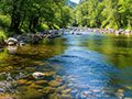 A clean river with water flowing through it